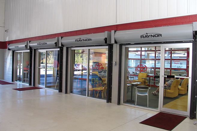 Fire-rated rolling doors above glass openings