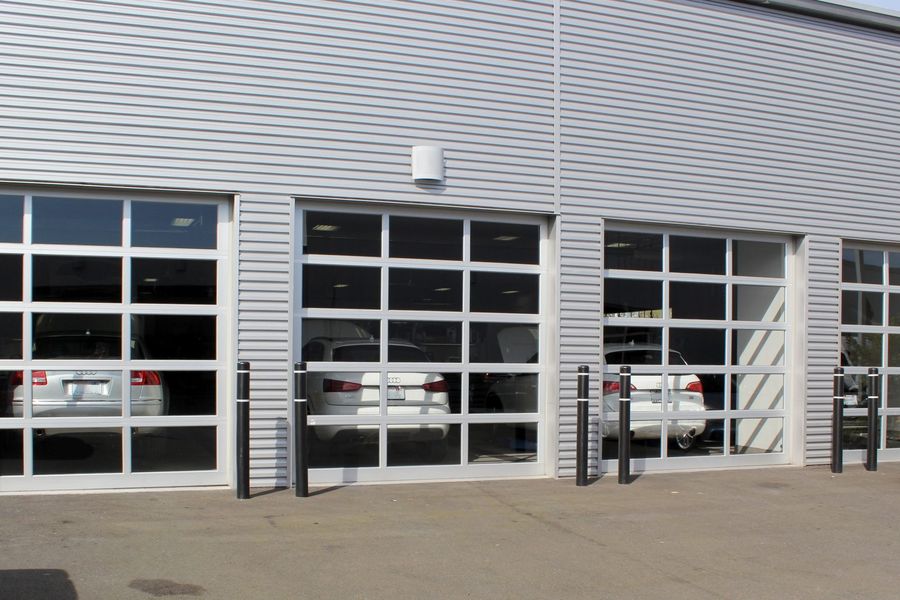 Aluminum and glass full-view doors on an auto service building